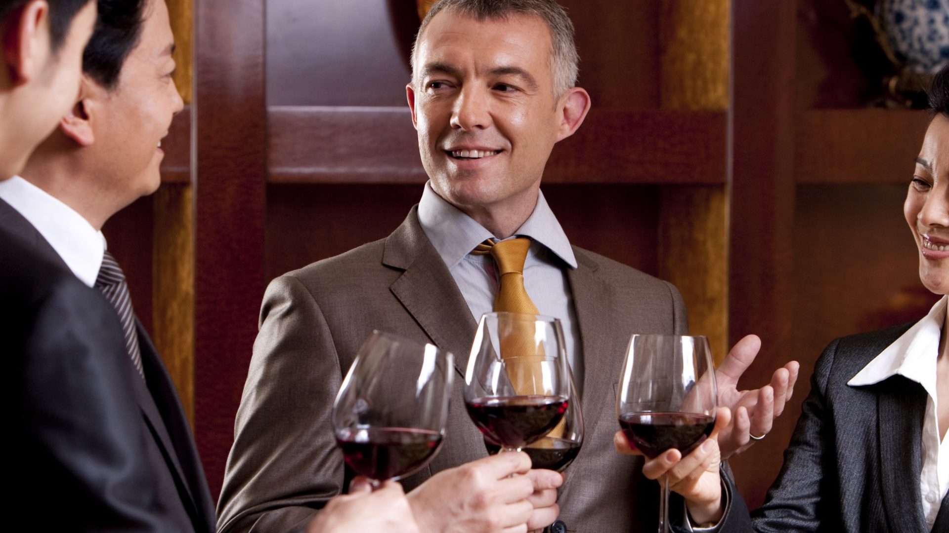 Business guests drinking wine