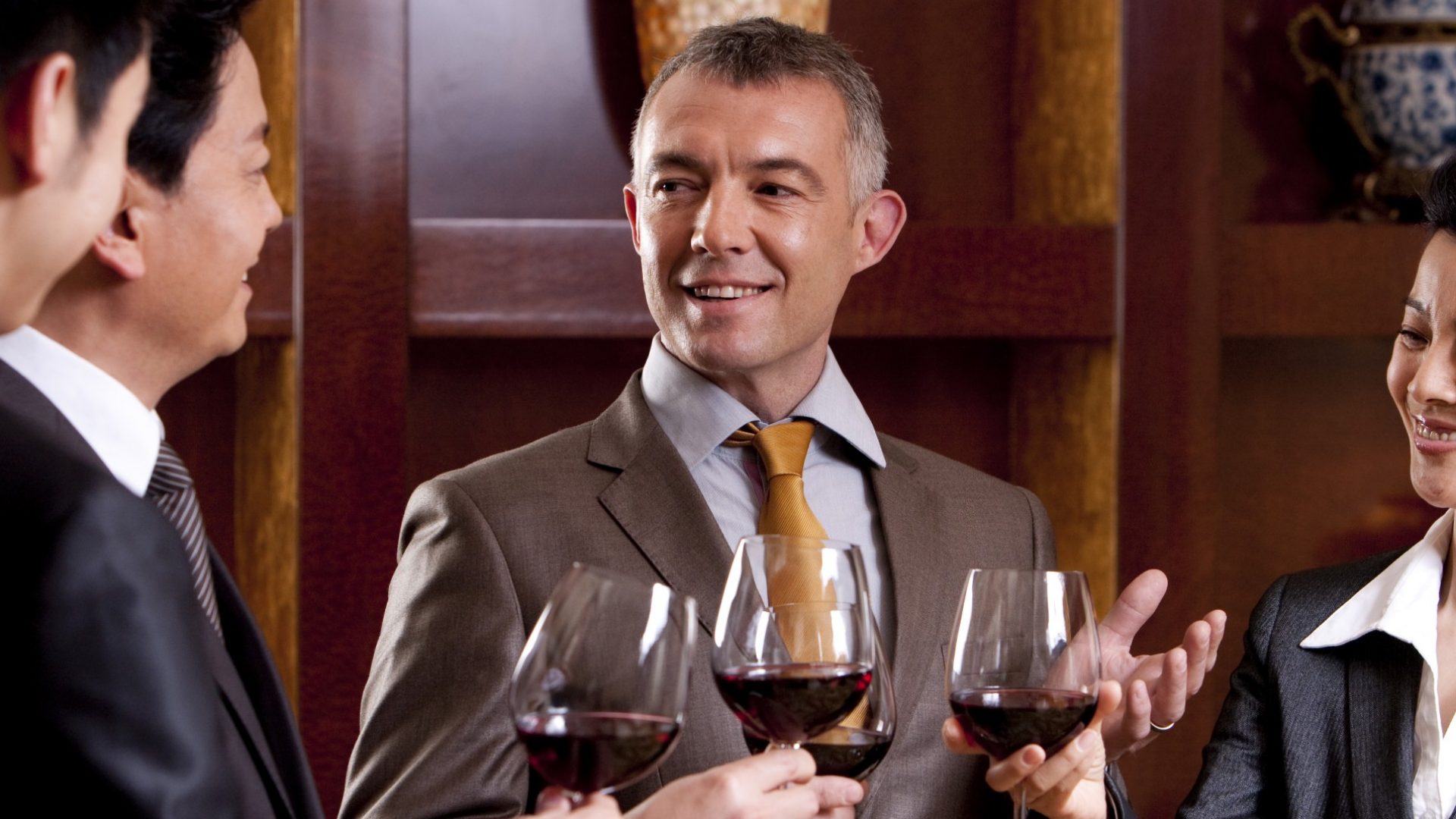 Business guests drinking wine